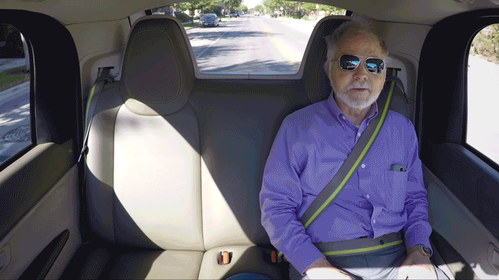 A video clip of a man riding in a self-driving car.